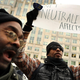 Demonstrators rally outside the Federal Communications Commission building to protest against the end of net neutrality rules Dec. 14, 2017, in Washington, D.C.